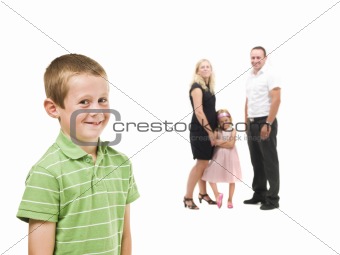 Young boy in front of his family