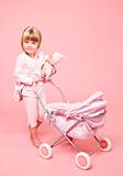 Young girl with baby stroller