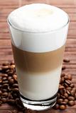 latte macchiato with coffee beans