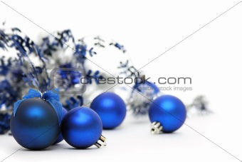 Blue Christmas balls on white background.