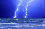 Thunderstorm and perfect Lightning over the wave ocean
