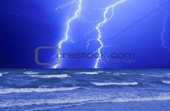 Thunderstorm and perfect Lightning over the wave ocean