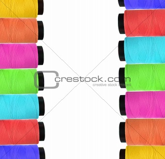 Few multicolor bobbins isolated on white background