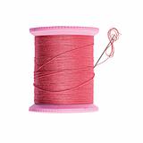 Bright red thread bobbin with needle isolated on white