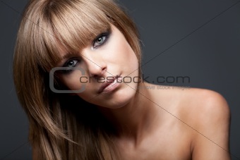 Blond girl with naked shoulders