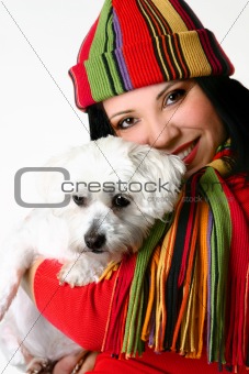 Beautiful woman holding a pet dog