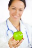 Female Doctor Holding Green Apple
