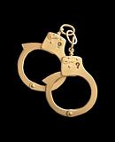 golden handcuffs isolated on black background 