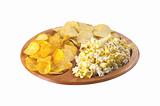 pop corn and potato chips on plate isolated on white background
