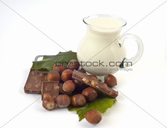Chocolate with hazelnuts and white milk jug