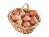 Group of brown hen's eggs in the braided basket isolated on whit