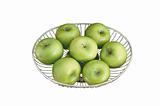 close up of green apples on plate isolated on white background