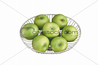 close up of green apples on plate isolated on white background