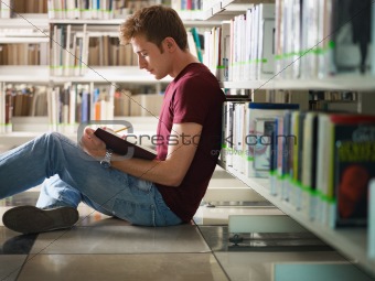 guy studying in library