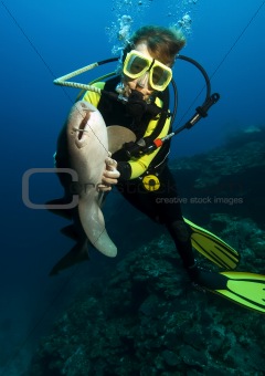 Diver with nurse shark