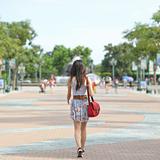 fashion girl walking on street with soft color tone