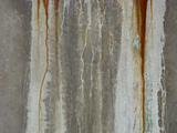 dirty gray green wall with dirt rust drips leaks
