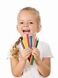 Happy little girl with colored pencils