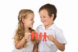Happy smiling kids holding paper people - isolated