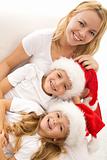 Happy kids and woman relaxing at christmas time