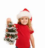 Little girl holding small christmas tree