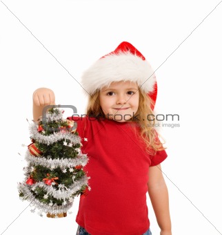 Little girl holding small christmas tree