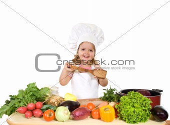 Happy little chef with lots of vegetables