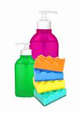 color sponges and bottles with cleaning liquid isolated on white