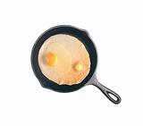 Fried egg in a frying pan isolated on a white background