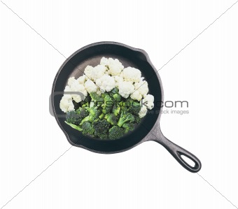 frying pan with vegetables isolated on white