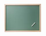 empty blackboard with wooden frame and chalks 