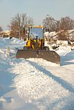 Tractor shoveling snow