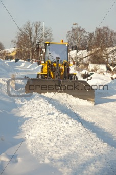 Tractor shoveling snow