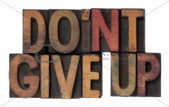 do not give up phrase in wooden type