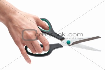 Feminine hand with scissors