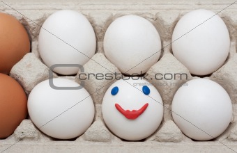 Egg in packing, smile