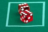 pair of dice on casino felt