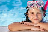 Happy Girl Child In Swimming Pool with Goggles and Snorkel