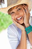 Beautiful Mixed Race Woman Laughing In Straw Cowboy Hat