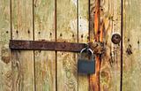 iron bolt on wooden door with the lock