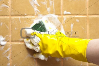 hand in yellow rubber glove