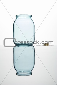 Coins and empty glass jar