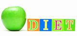green apple and cubes with letters - diet