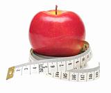 tape measure wrapped around red apple