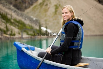 Woman Canoeing on Lake