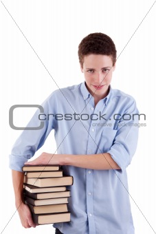 young and beautiful boy, with books on the hands, isolated on white background. Studio shot