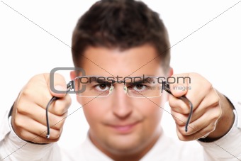 Young businessman holding glasses