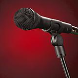 Microphone Isolated On Red Background