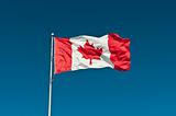 Waving Canadian Flag with Blue Sky