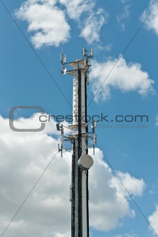 White Antenna Tower with Blue Sky and Clouds